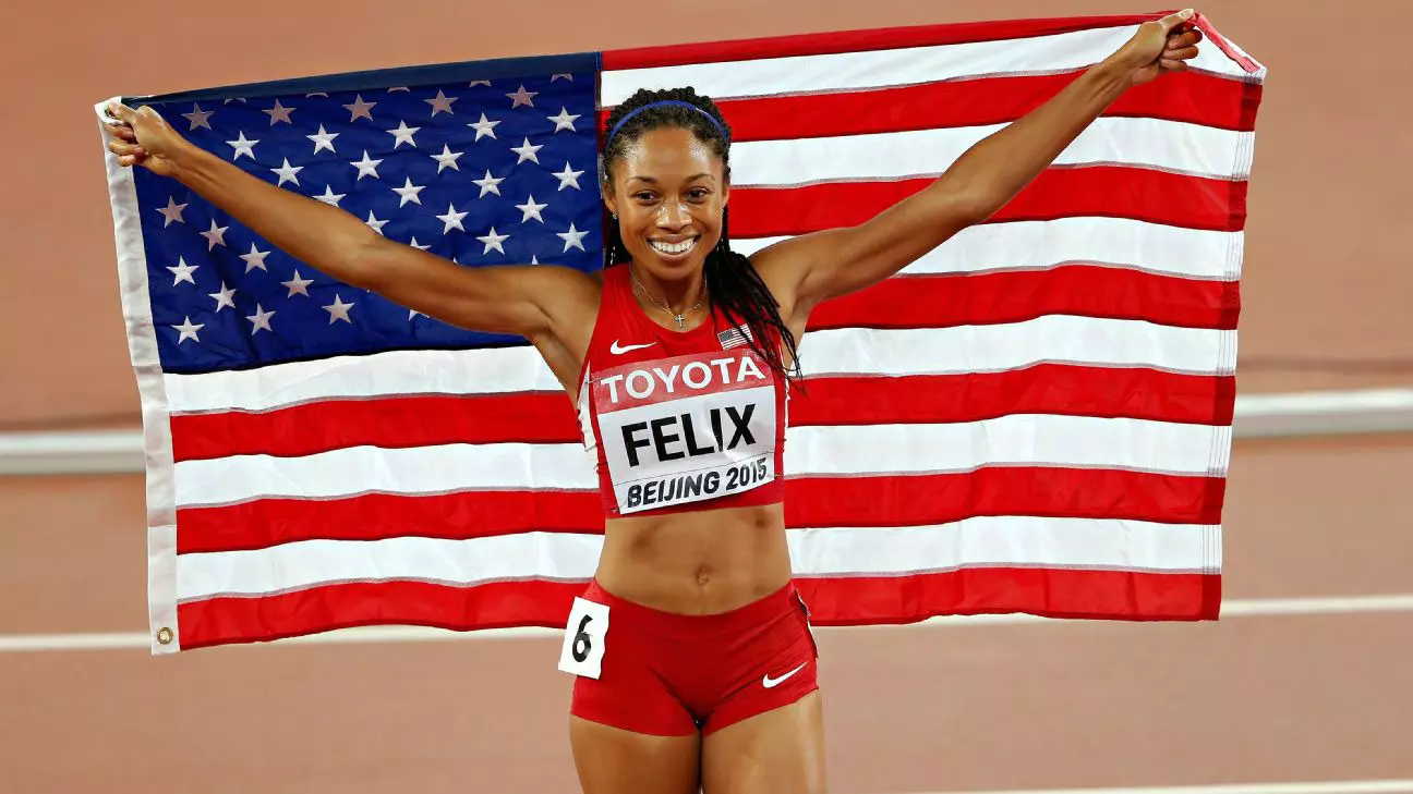 Allyson Felix holding US flag
