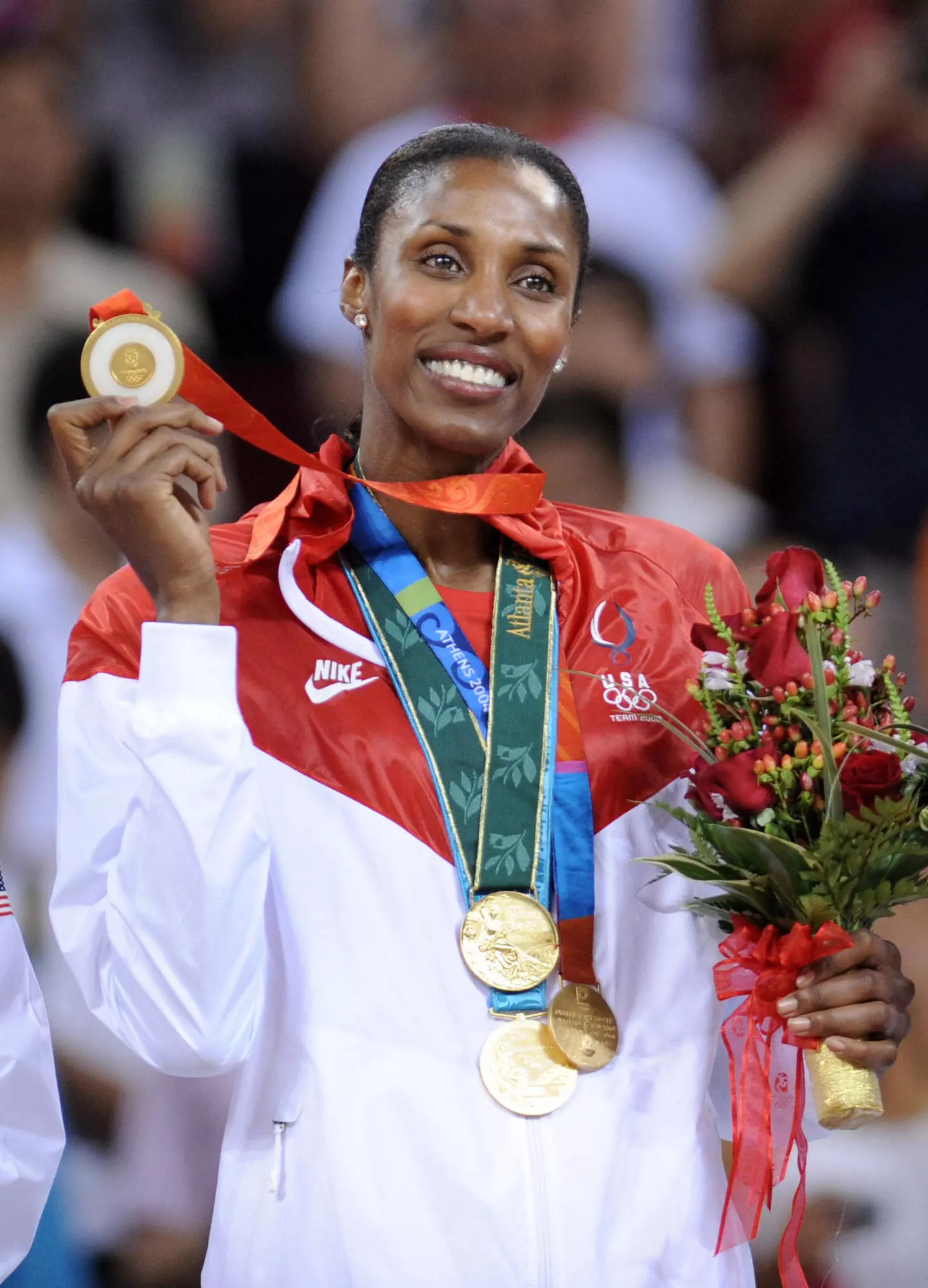 LISA LESLIE SHOWING OFF GOLD MEDAL