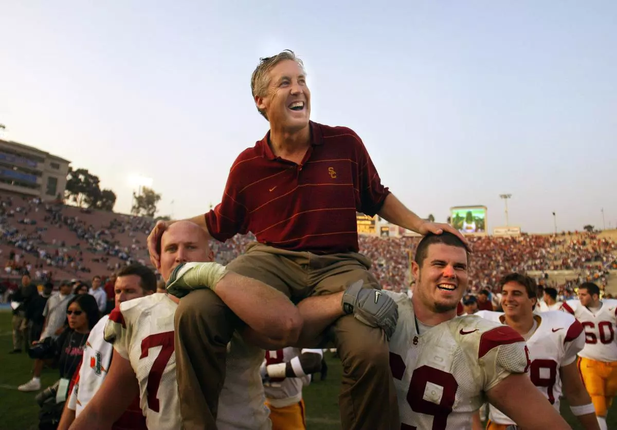 Pete Carroll on shoulders