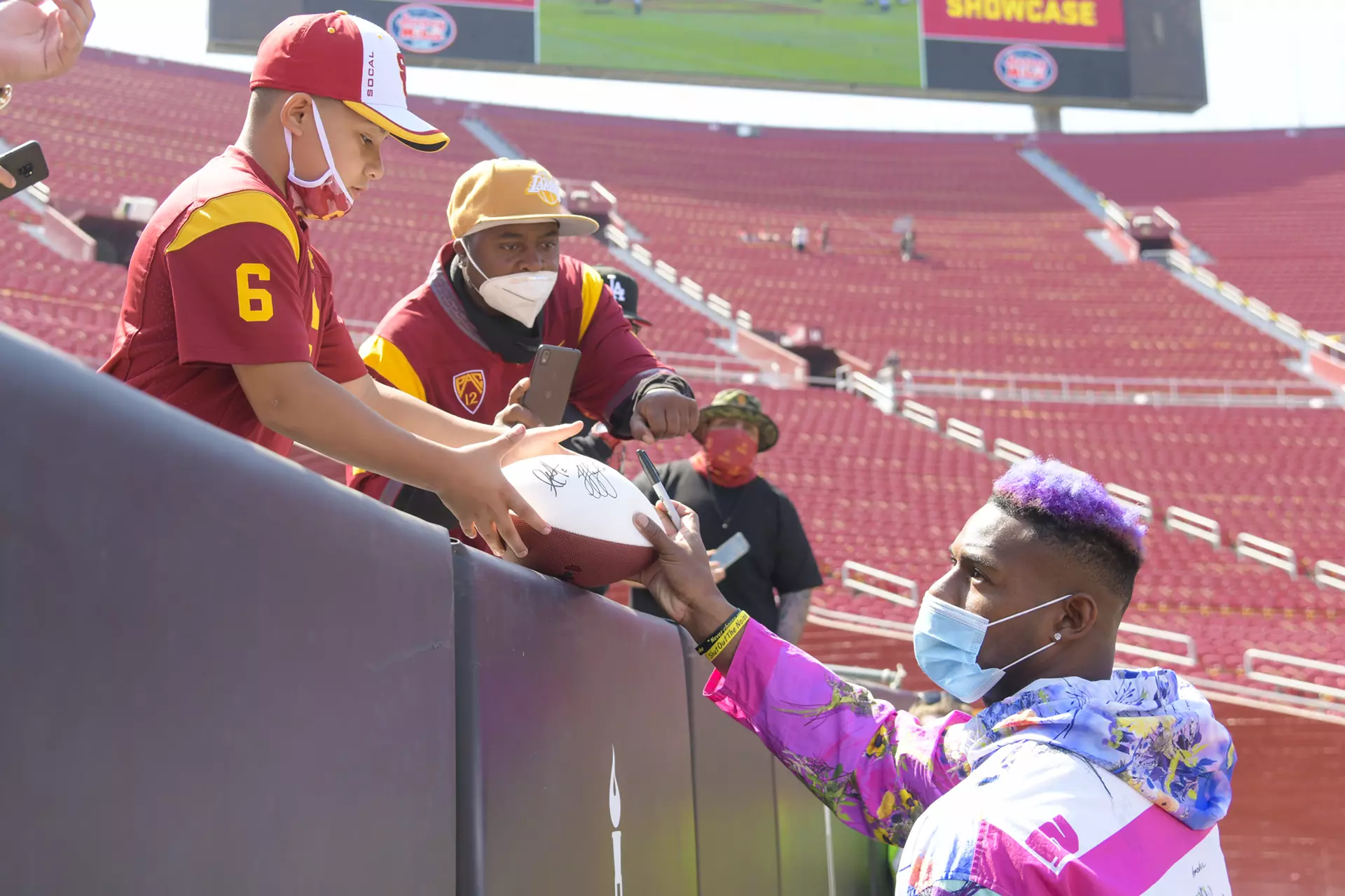 JuJu Smith-Schuster with fan at spring showcase