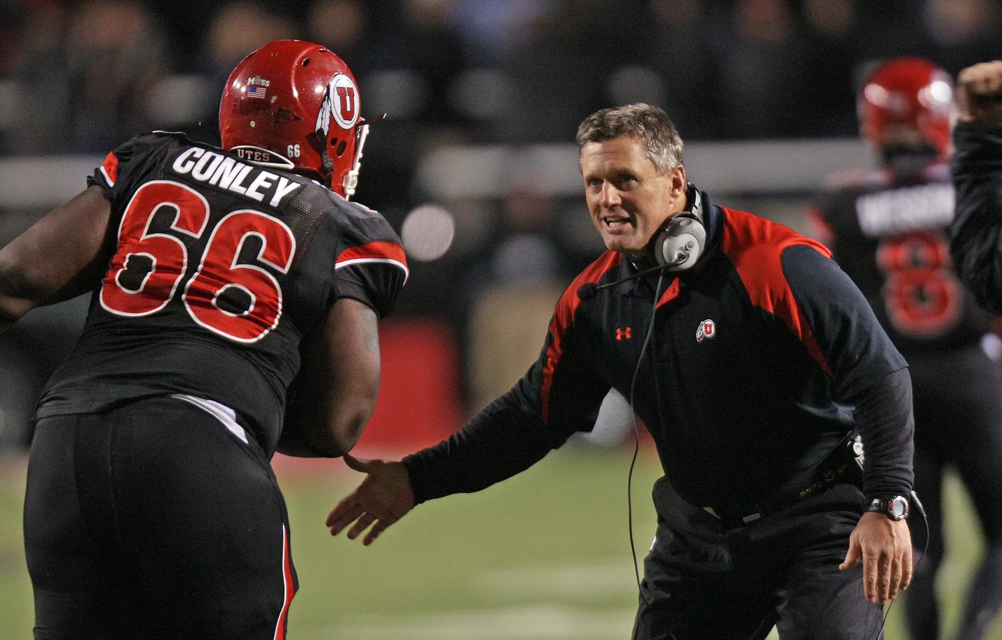 Utah coach Kyle Whittingham congratulates Robert Conley as the University of Utah defeats TCU in MWC football 13-10 in Salt Lake City, Utah Nov, 6, 2008. Photo by Tom Smart