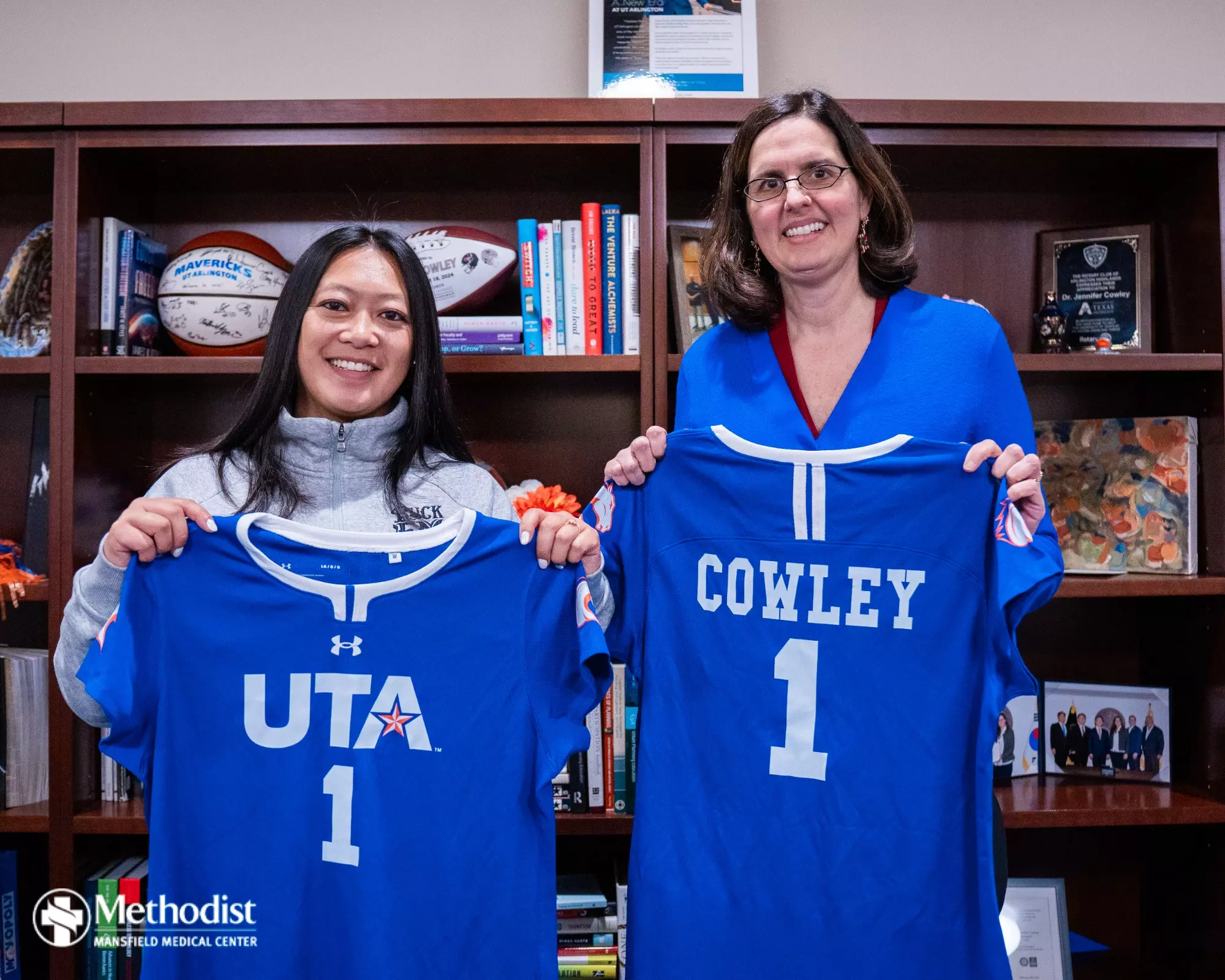 UTA Flag Football Head Coach Melinda Nguyen with UT Arlington President, Dr. Jennifer Cowley.