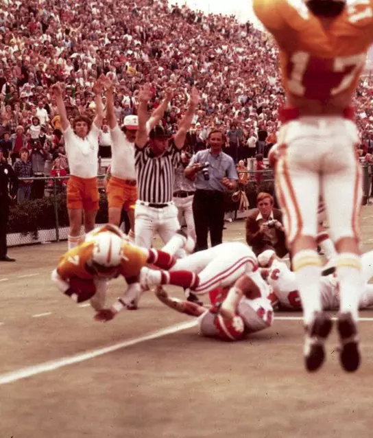 KNOXVILLE,TN - quarterback Condredge Holloway #7 scores a touchdown in Knoxville, TN.
