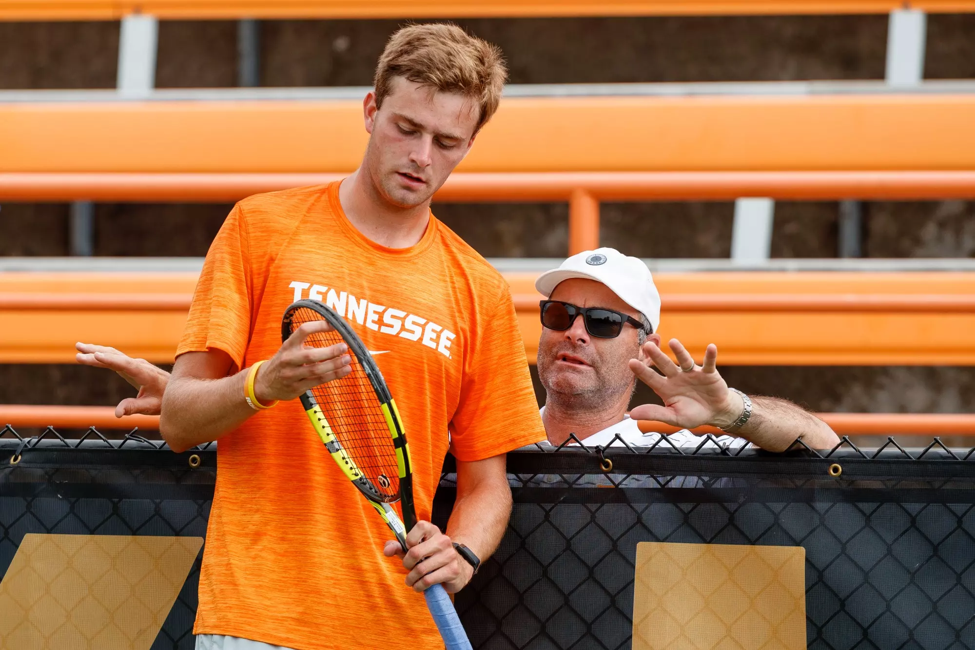 KNOXVILLE, TN - May 03, 2024 - Johannus Monday and Head Coach Chris Woodruff of the Tennessee Volunteers during the 2024 Men?s Tennis tournament first round match between the ETSU Buccaneers and the Tennessee Volunteers at Barksdale Stadium in Knoxville, TN. Photo By Ian Cox/Tennessee Athletics