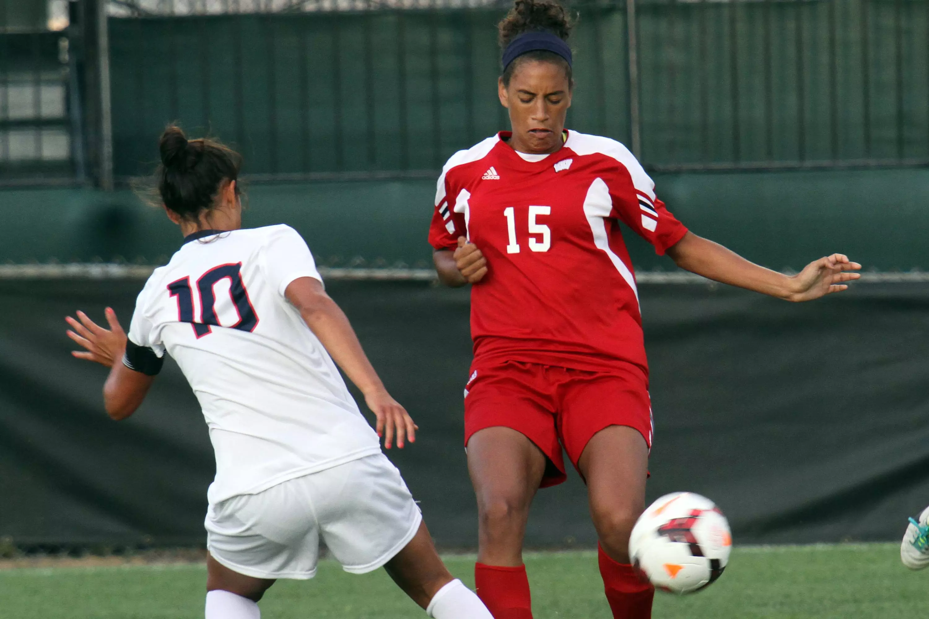 Cara Walls (15) dribbles during Wisconsin's game vs. UConn on Aug. 23, 2013. (David Stluka)