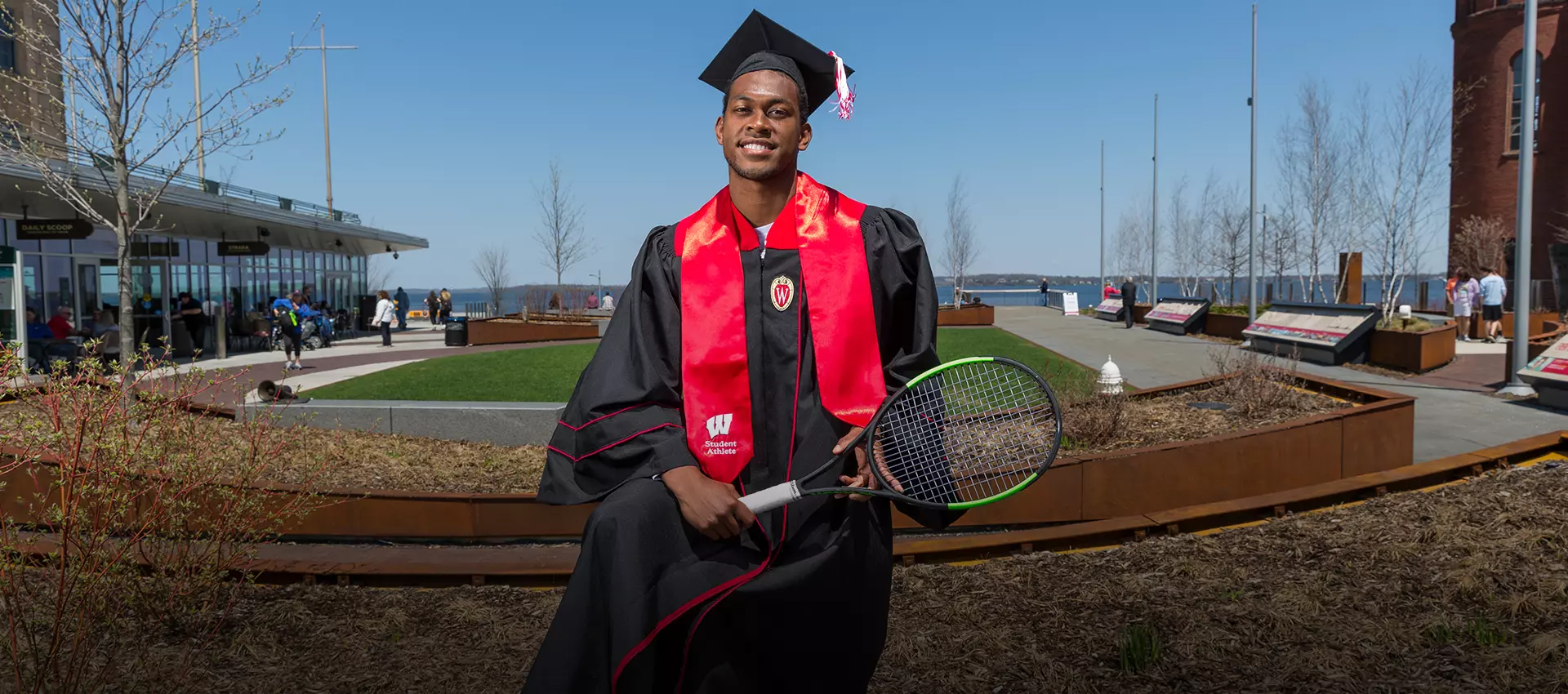 Lamar Remy poses for a graduation photo at Alumni Park on the campus of UW-Madison