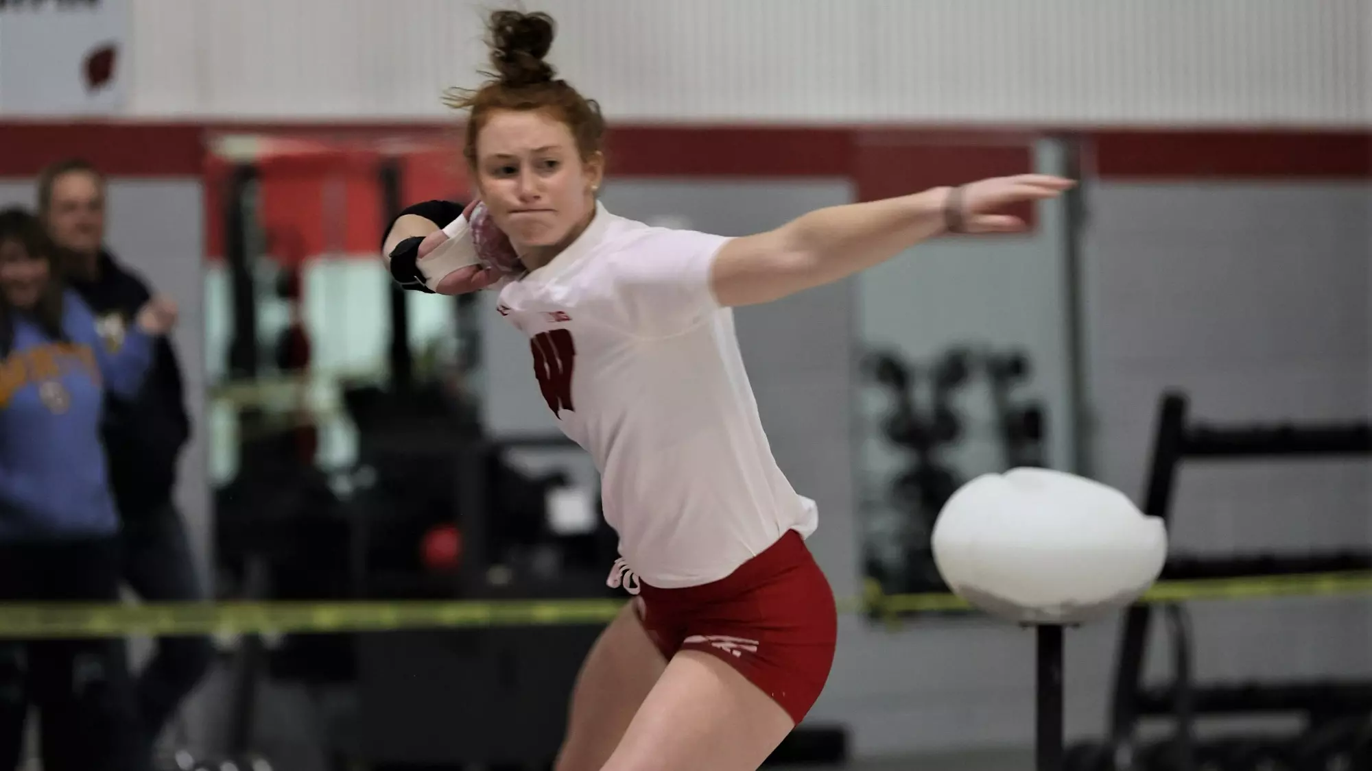 Josie Schaefer competes in the shot put.