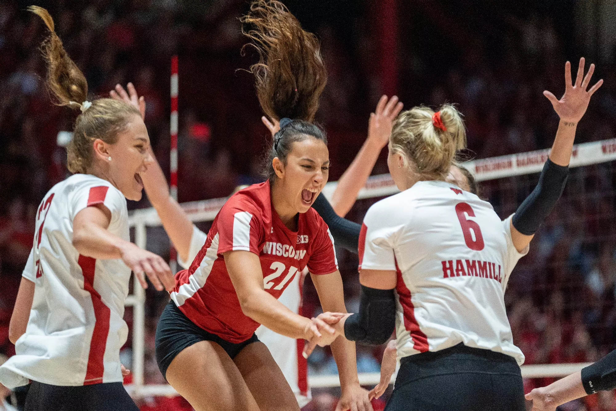 Wisconsin volleyball celebration against Marquette during a 2022 match