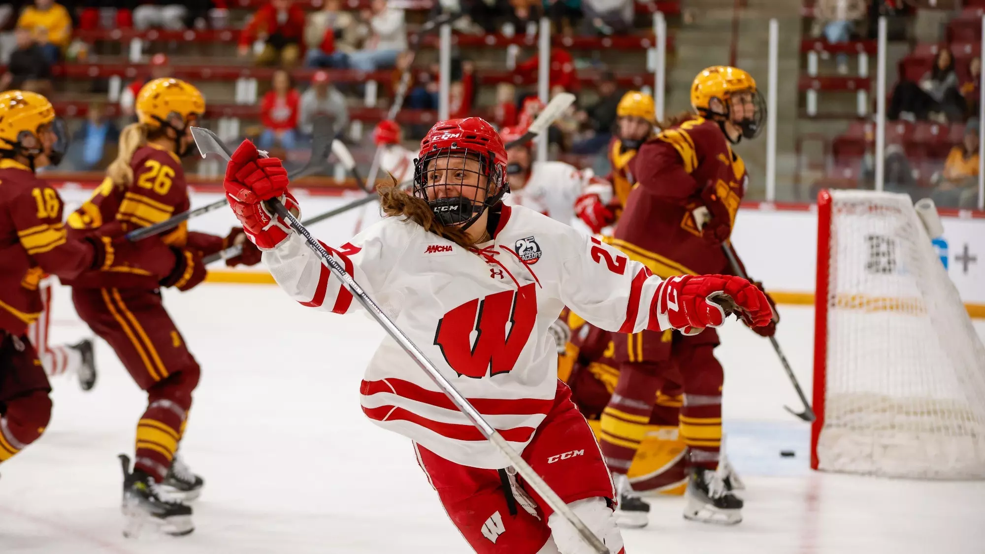 Kirsten Simms celebrates a goal against Minnesota in the WCHA Final Faceoff semifinal game