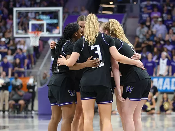Women's Basketball team huddle