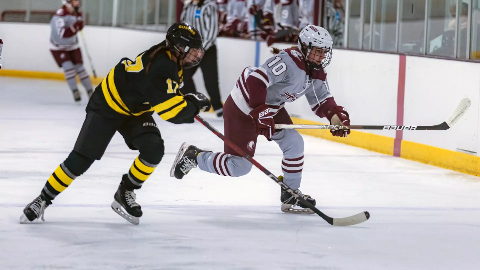 Jenna Allen skates past a defender during a 2024-25 Augsburg women's hockey game.