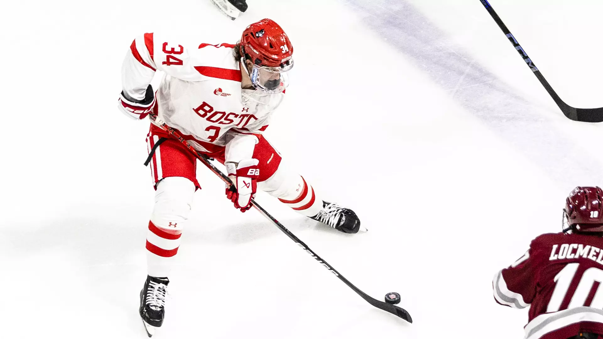 Cole Eiserman skates with the puck against UMass