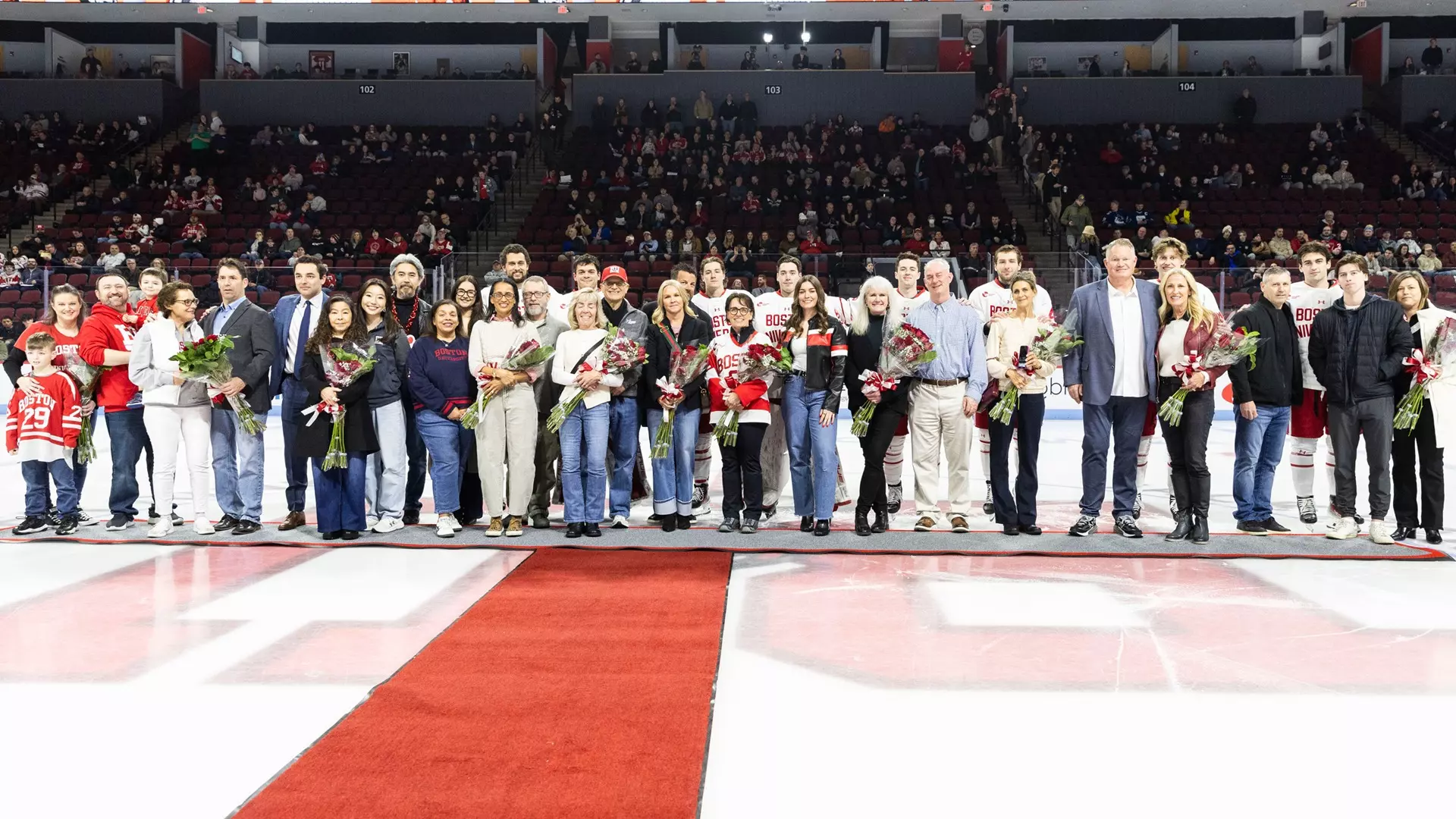 BU Men's Hockey Class of 2025 and their families on Senior Night at Agganis Arena