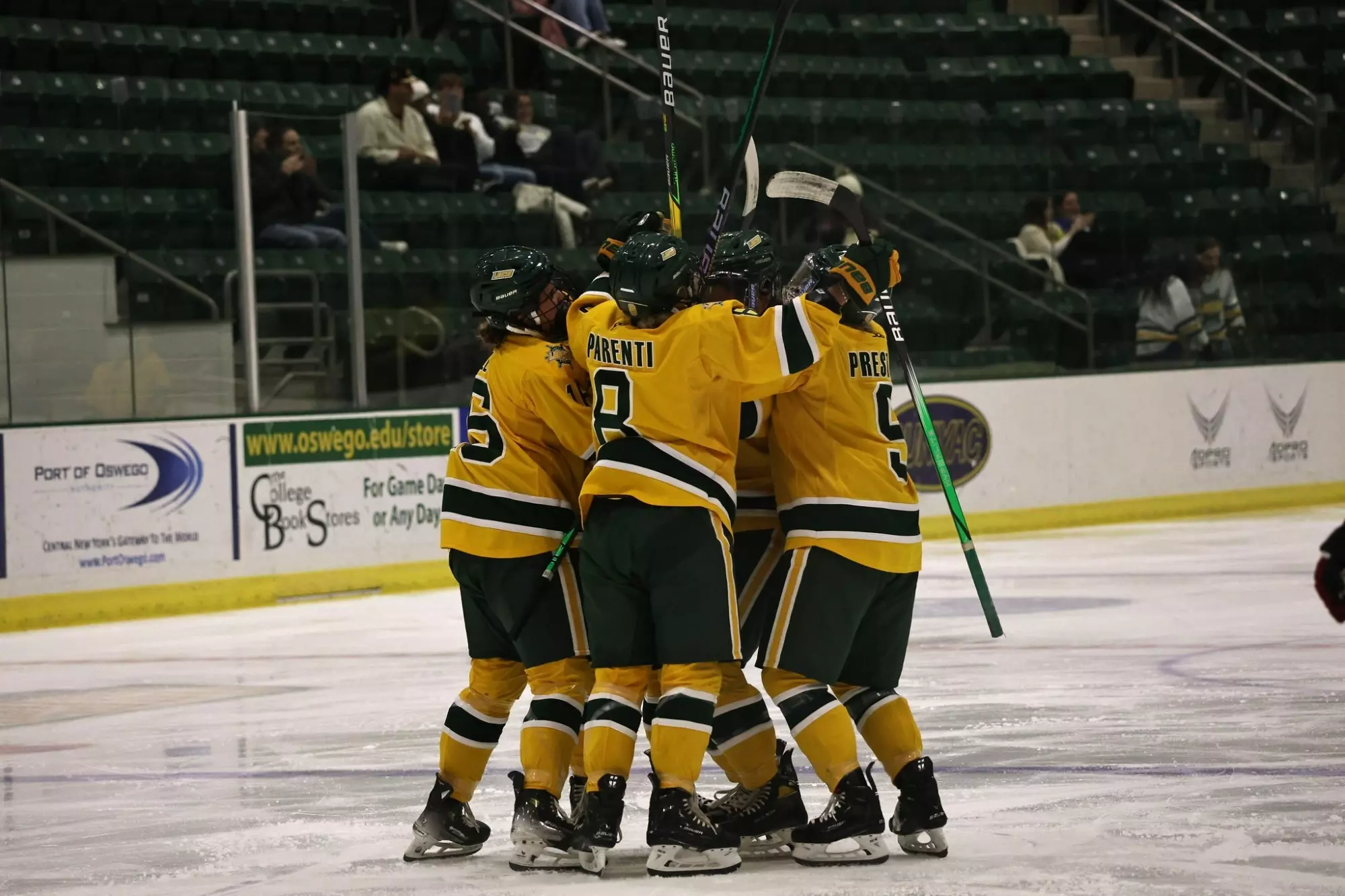 Lakers womens hockey celebrating a goal