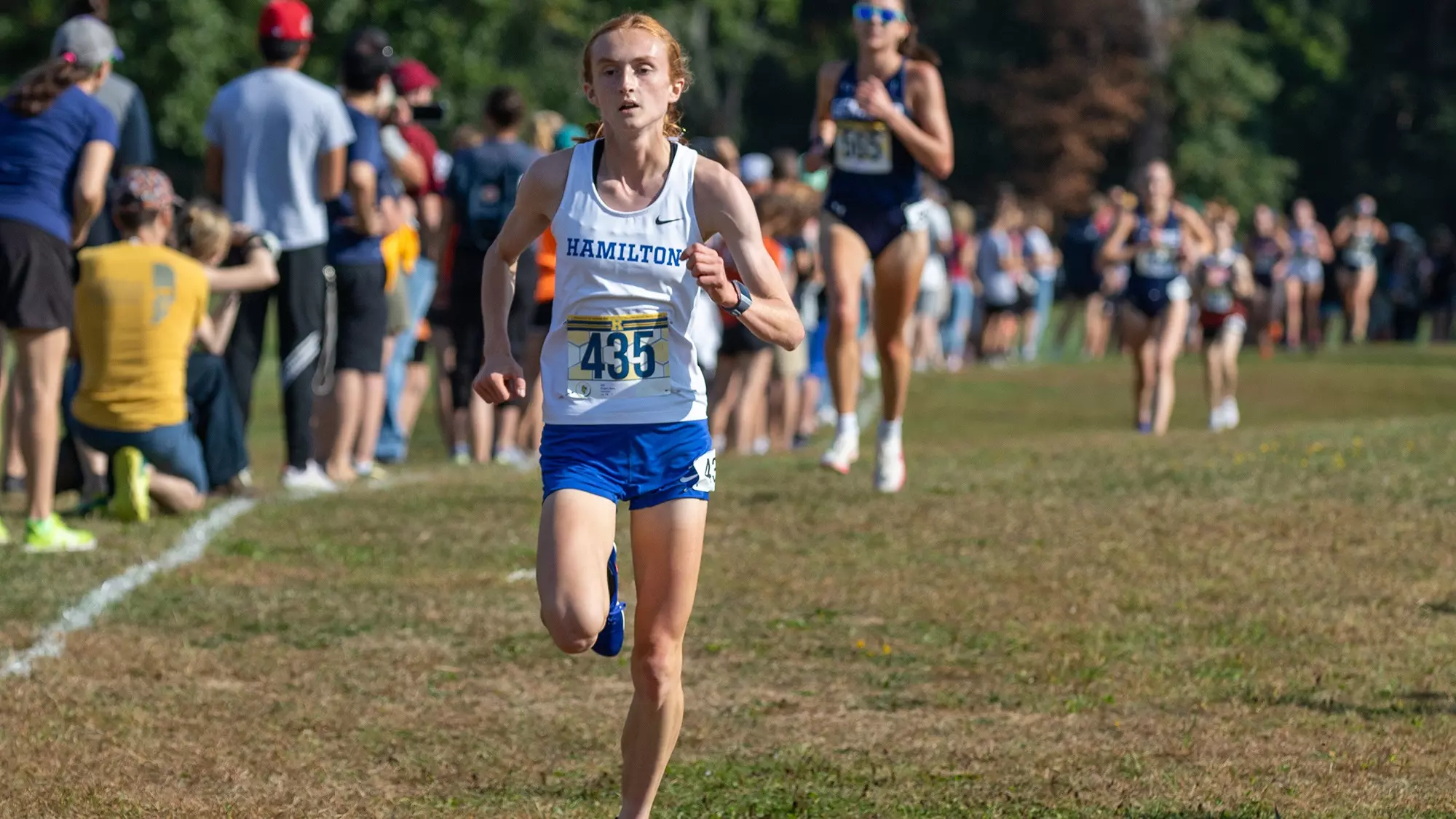 Keira Rogan Rochester Rogan '28 leads women's cross country to 4th place at Rochester ...