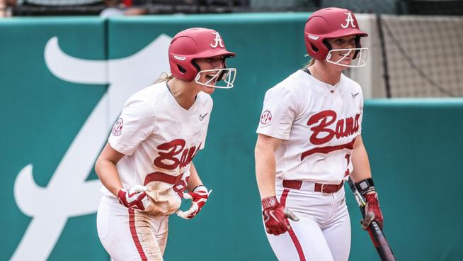 Jenna Johnson (88) and Emma Broadfoot (12) celebrate at home after Alabama takes the lead over USC Upstate (May 17, 2024)