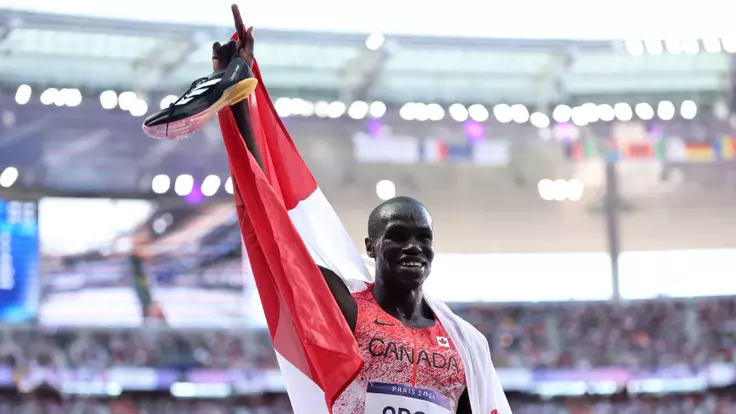 PARIS, FRANCE - AUGUST 10: Silver medalist Marco Arop of Team Canada celebrates after competing in the Men's 800m Final on day fifteen of the Olympic Games Paris 2024 at Stade de France on August 10, 2024 in Paris, France. (Photo by Hannah Peters/Getty Images)