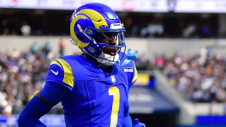 Sep 28, 2025; Inglewood, California, USA; Indianapolis Colts wide receiver Michael Pittman (11) scores a touchdown ahead of Los Angeles Rams cornerback Emmanuel Forbes Jr. (1) during the second half at SoFi Stadium. Mandatory Credit: Gary A. Vasquez-Imagn Images