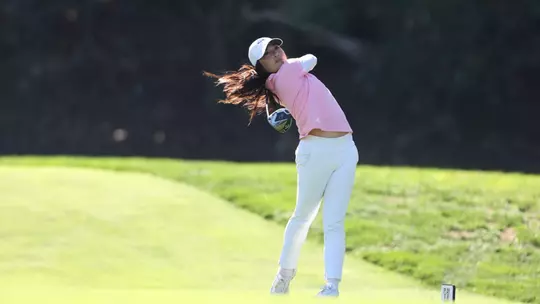 Carmen Lim finishing golf swing at Stanford Intercollegiate