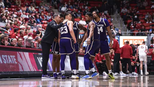 Team huddle at Washington State