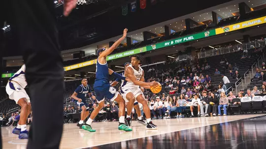Wesley Yates III driving to the hoops vs Nevada