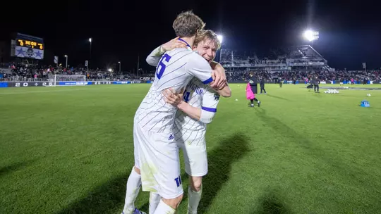 Joe Dale celebrates with Zack Meier after the Huskies advance to the National Championship match.