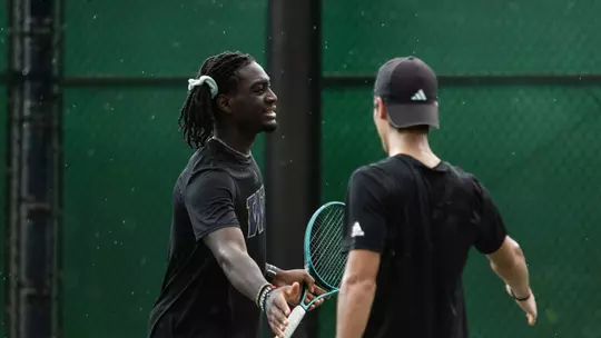 Stephane Kamendje warms up vs Hawaii
