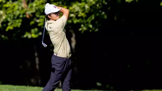 Jacob Goode follows shot after hitting the ball