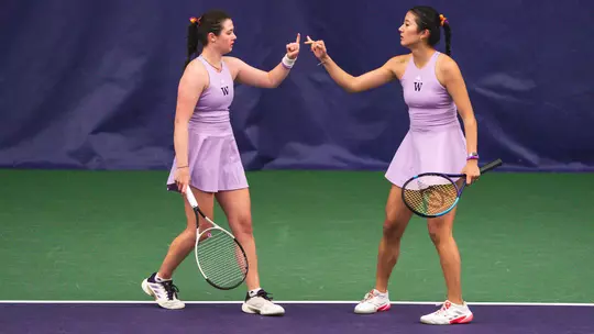 Carina Syrtveit and Erika Matsuda high five following a point