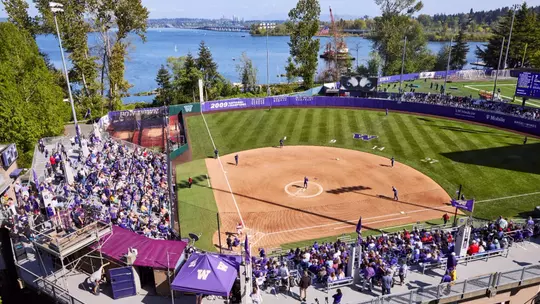 The University of Washington softball team plays Nebraska on April 26, 2025. (Photography by Blake Dahlin/Red Box Pictures)