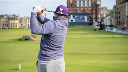 Finn Koelle hits a tee shot on 18 at the Old Course