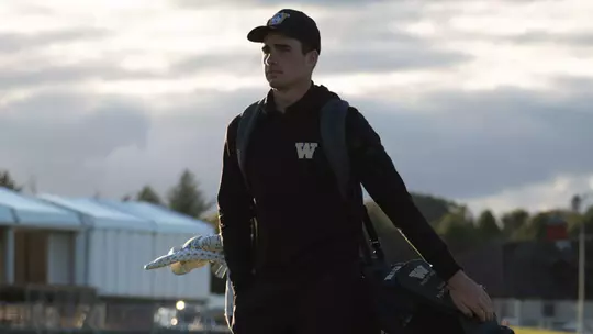 Hamish Farquharson walks with his bag on his back