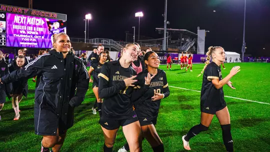 Jadyn Holdenried and Andrea Leyva celebrate UW's 1-0 win over USC