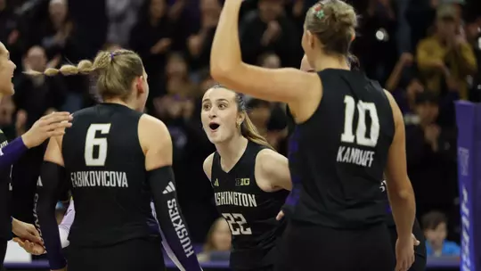 Sammy Destler celebrating a point against the Hawkeyes