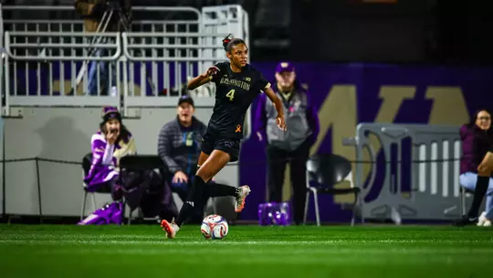 Maya Loudd dribbles down the sideline versus USC