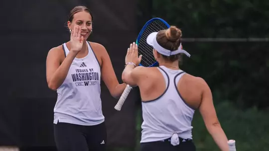 Alexia Jacobs and Marie Weissheim high five during the ITA All-American Championship