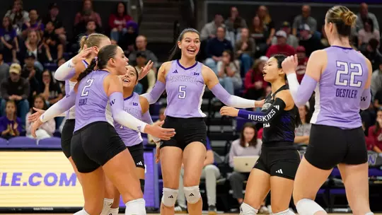 Simona Mateska in the middle of a team celebration against WSU