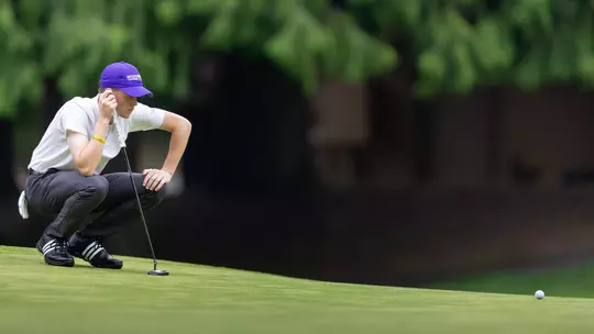 Jack Murphy reads a putt