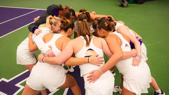 Women's tennis team huddle