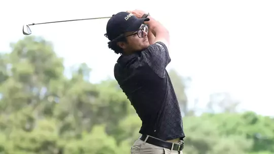 Jacob Goode follows through with his iron looking toward ball