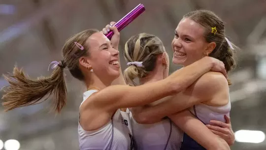 Chloe Thomas and Chloe Foerster celebrate a Big Ten title in the DMR