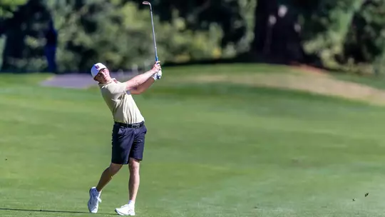 Finn Koelle hits an approach shot