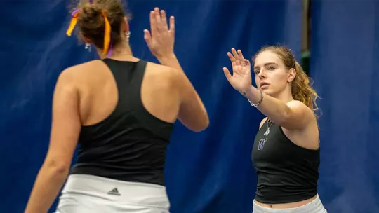 Alexia Jacobs and Marie Weissheim high five