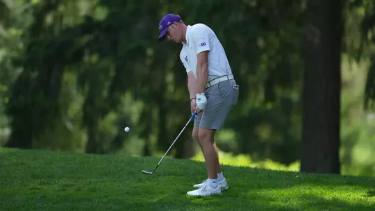 Finn Koelle chips the ball out of the green-side rough on the second day of the Big Ten Championships