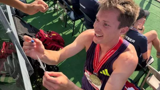 nathan green signing autographs after winning the usa 1500m title