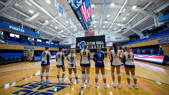 Seton Hall lines up for the National Anthem prior to a volleyball game