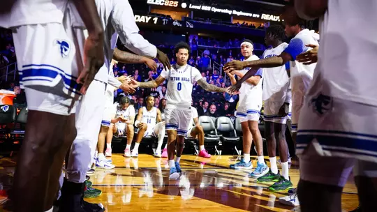 Budd Clark Walking Through Handshake Line During Pregame Introductions vs Saint Peter's