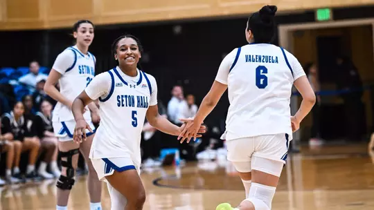 Savannah Catalon and Mariana Valenzuela exchange a high five during Seton Hall's game against Xavier on Dec. 28