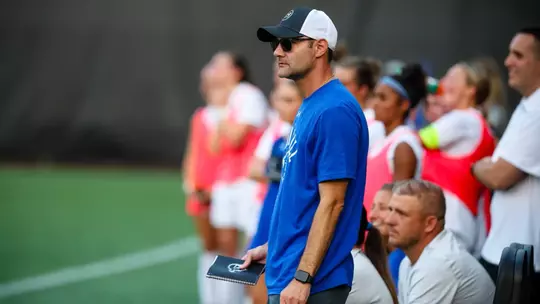 Josh Osit stands on the sideline in a game against Marist