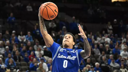 Feb 7, 2026; Omaha, Nebraska, USA; Seton Hall Pirates guard Adam Clark (0) scores against the Creighton Bluejays during the first half at CHI Health Center Omaha. Mandatory Credit: Steven Branscombe-Imagn Images